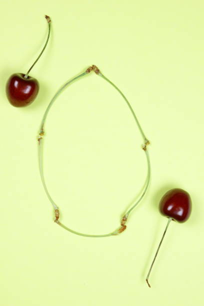 istock Red and yellow cherries on a multi-colored pastel background, cherries pop art, greeting card with yellow and red berries, cherry in the style of minimalism, vegetarianism, fruit pop art 921246068