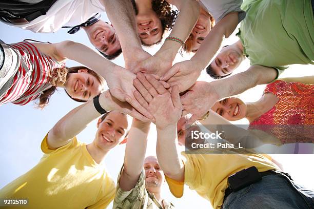 Group Of Nine Friends Keep For Hands Stock Photo - Download Image Now - Adult, Below, Cheerful