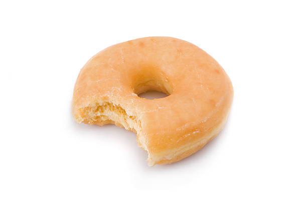 istock Bitten sugar glazed doughnut or donut isolated on white 92125254