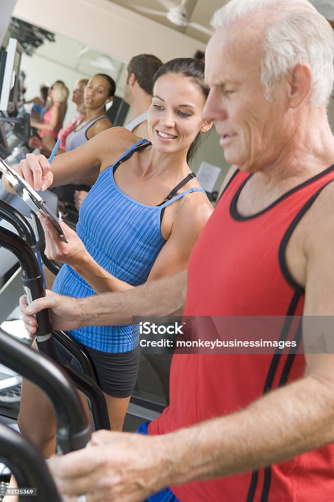 Personal Trainer Instructing Man  20-29 Years Stock Photo