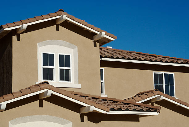 Abstract of New Stucco Wall Construction and Windows stock photo