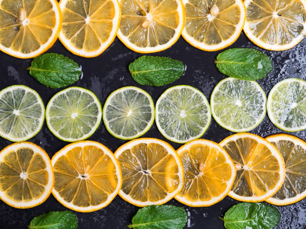 istock Limes and lemons slices over dark slate 921257492