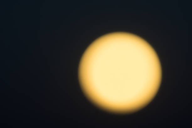 istock Golden glow against black night sky. 921257572