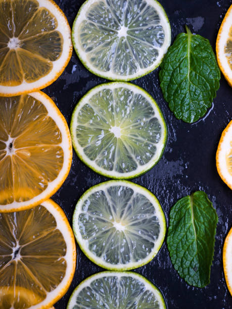 istock Limes and lemons slices over dark slate 921257580