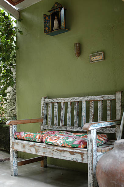 istock Old bench in front of a green wall 92126311