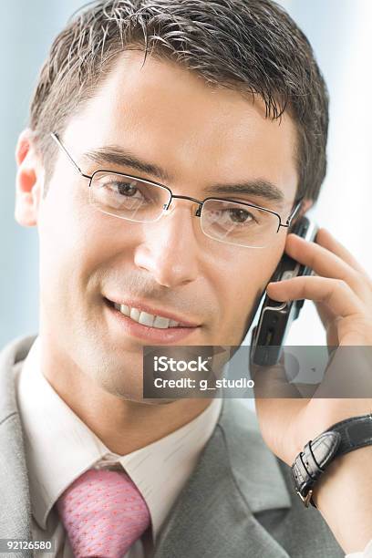 Businessman With Cellphone At Office Stock Photo - Download Image Now - 30-34 Years, 30-39 Years, Adult