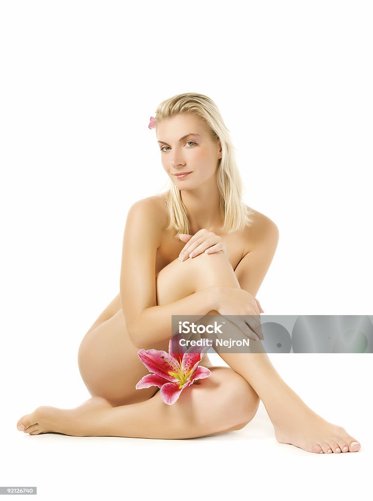 Beautiful young woman with pink lily flower  Adult Stock Photo