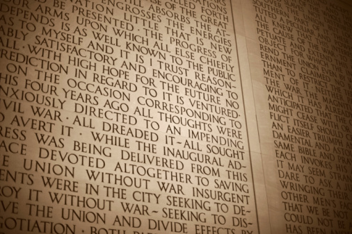 Selective focus view of interior of Lincoln Memorial in Washington, DC showing inscription of Lincoln's Second Inaugural Address.  B/W, sepia toned.