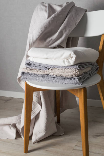 istock Clean towel on the white chair. Laundry day 921269742