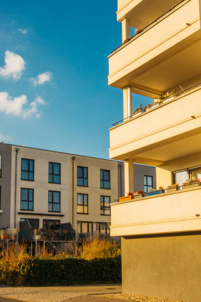 istock modern apartments and townhouses with copy space in the sky on the left side 921270708