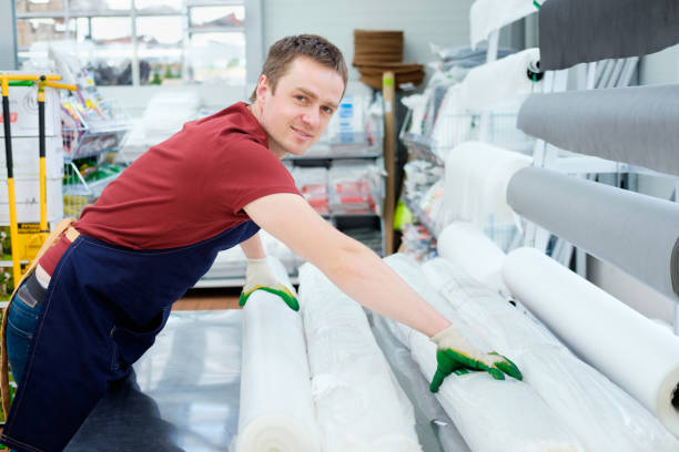 istock seller in building equipment tools store at work 921276492