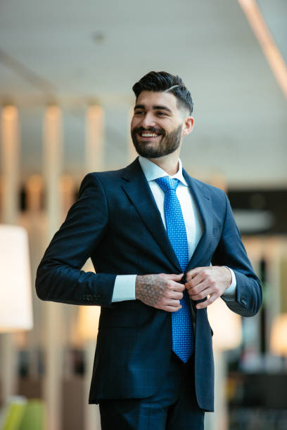 istock Young businessman getting ready for meeting 921277294