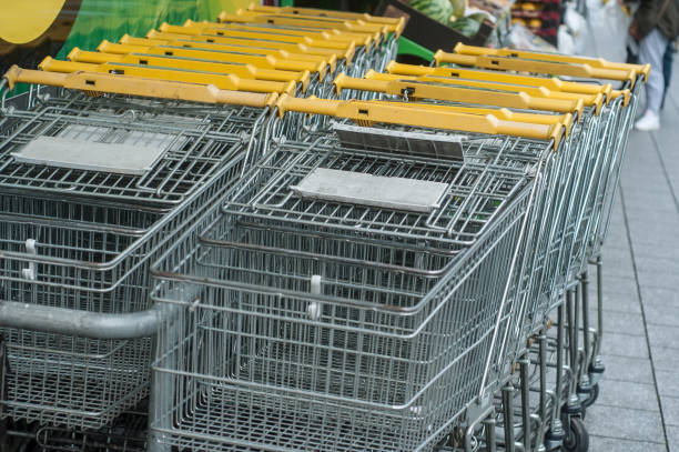 istock yellow supermarket trolleys alignment 921279786