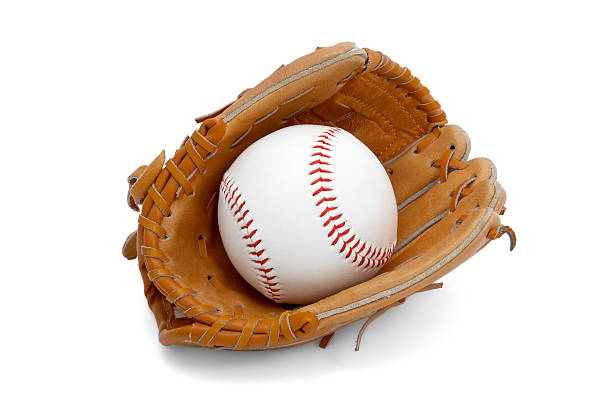 Close up of brown leather baseball glove with ball with red stitching in it on white background as concept for ball sports and leisure activities