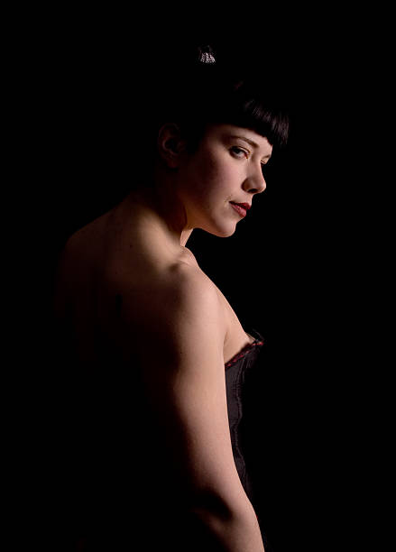 istock Darkhaired young woman examines the viewer. 92128250