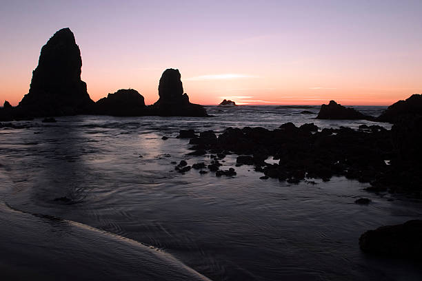 Sunset on Sea stack formations off the town of Bandon Beach on the Oregon Coast