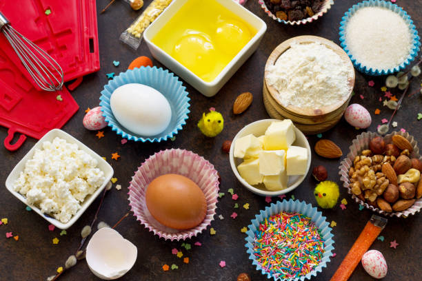 ingredienti per la cottura pasquale - ricotta, noci, uova, farina, lievito, burro, uvetta e zucchero. - easter bonnets immagine foto e immagini stock