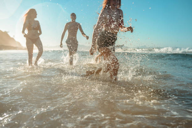 istock Young friends having fun by the sea 921284338