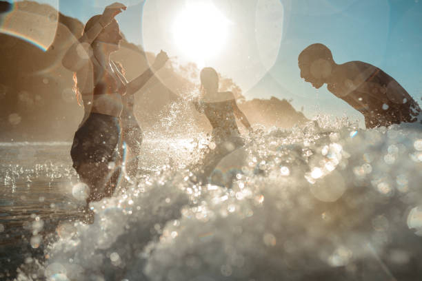 istock Young friends having fun by the sea 921284344