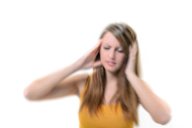 istock Young beautiful woman with severe headache 921284574