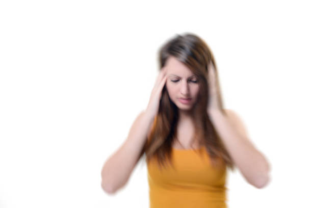 istock Young beautiful woman with severe headache 921284582