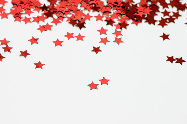 красная звезда дождь - star shape confetti red nobody стоковые фото и изображения