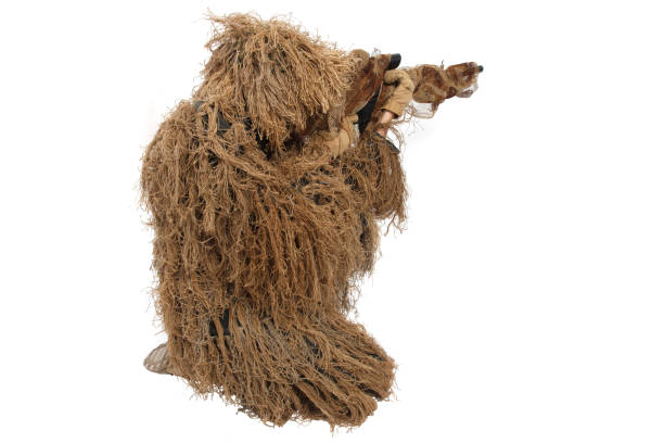 istock sniper in ghillie suit isolated on white 921287194