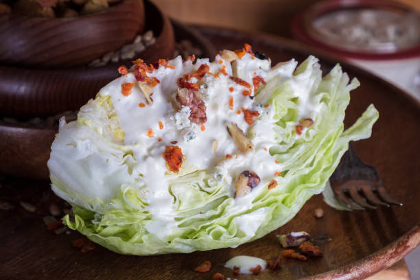 istock Blue Cheese Salad Dressing over Iceberg Lettuce Wedge 921287376