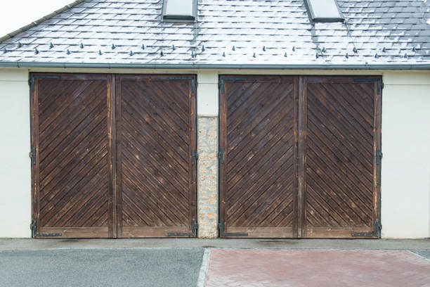 istock two big brown wooden doors of  garage 921290564