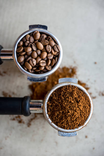 istock Ground coffee in porta filter with beans 921290586