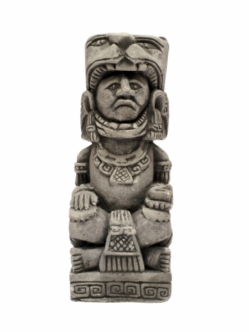 little mayan or incan statue isolated on white background