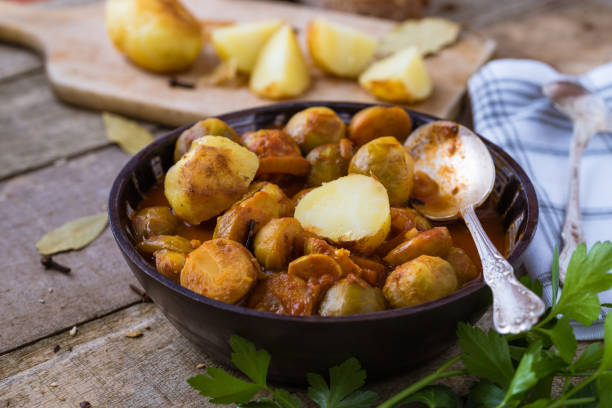 istock Roasted fresh brussels sprouts with potatoes in homemade ceramic bowl. 921293786