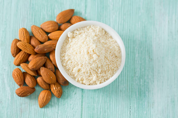 almond flour on wooden surface - fotografia de stock