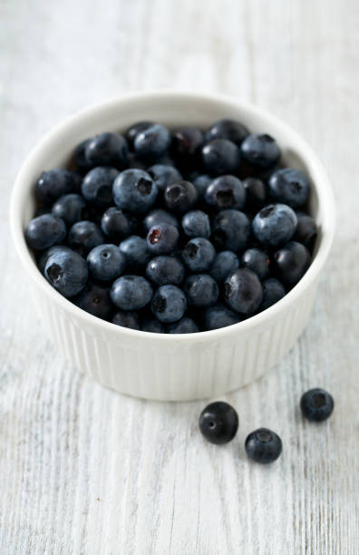 istock blueberry on wooden surface 921294124