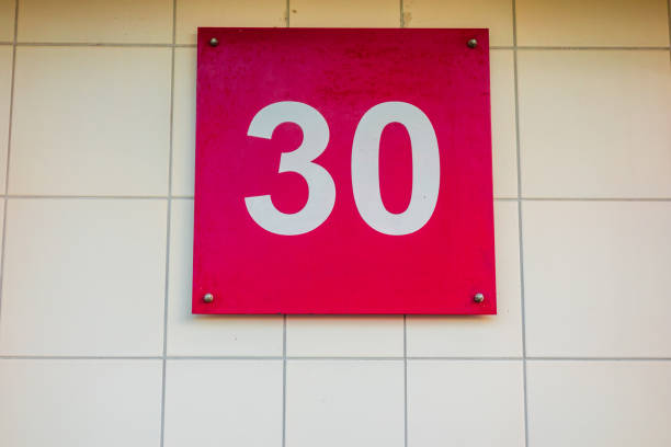 istock red number 30 door sign 921294374