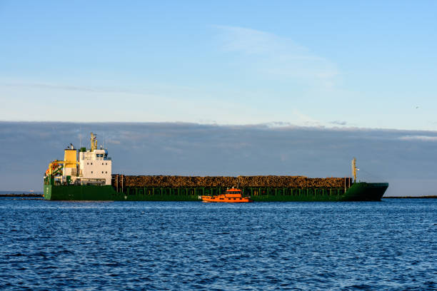 istock cargo ship is leaving port sailing away 921297046