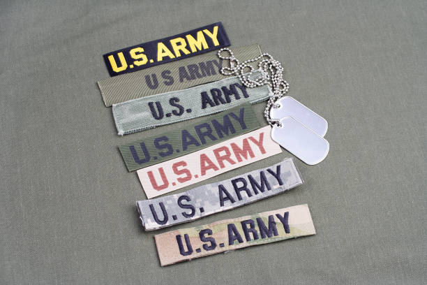 istock US military service tapes on olive green uniform background 921297072