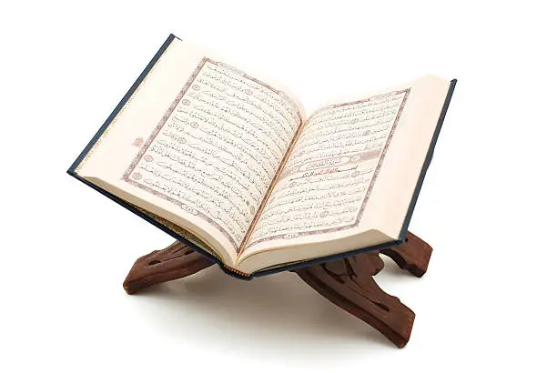 The Holy Quran openned on a wooden stand