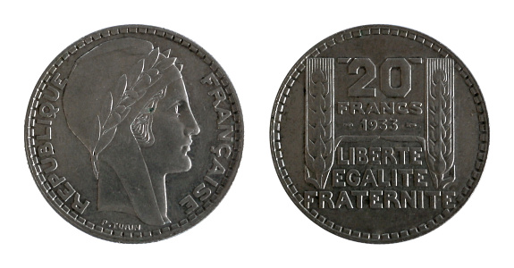 French coin of twenty francs minted in 1933, laureate head of Marianne on the left side and value and date and the inscriptions in French liberty, equality, brotherhood between two ears of wheat on the right side.