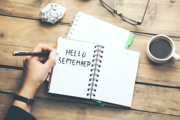 istock september text on paper with stationary 921312230