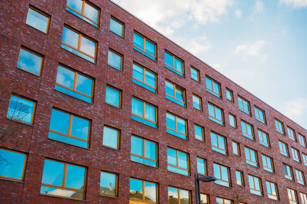 istock big brick apartment building with square windows 921315168