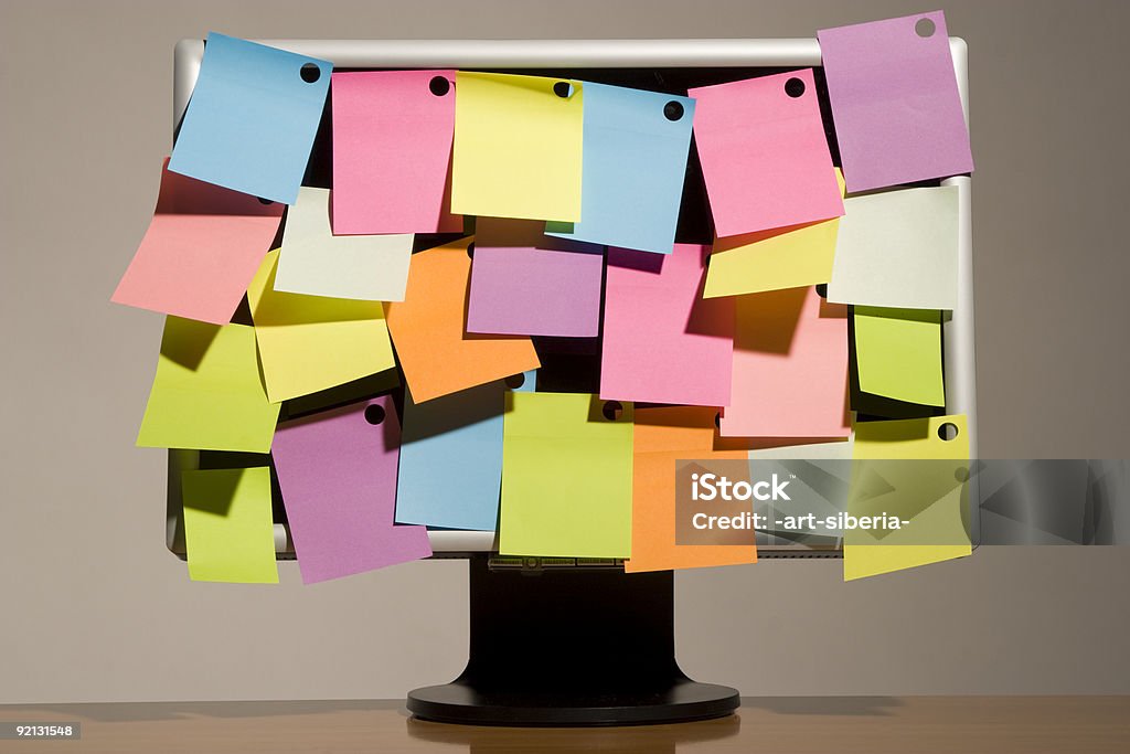 sticky notes and wide screen multicoloured sticky notes and liquid-crystal wide screen Adhesive Note Stock Photo