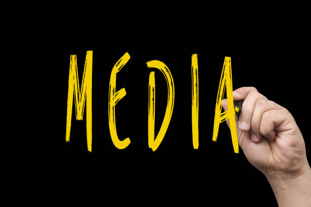 istock Hand writing Media with yellow marker on black chalkboard 921318330