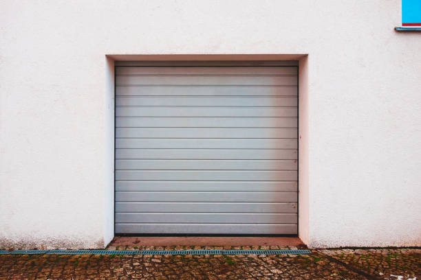istock grey garage entrance on white wall 921321778