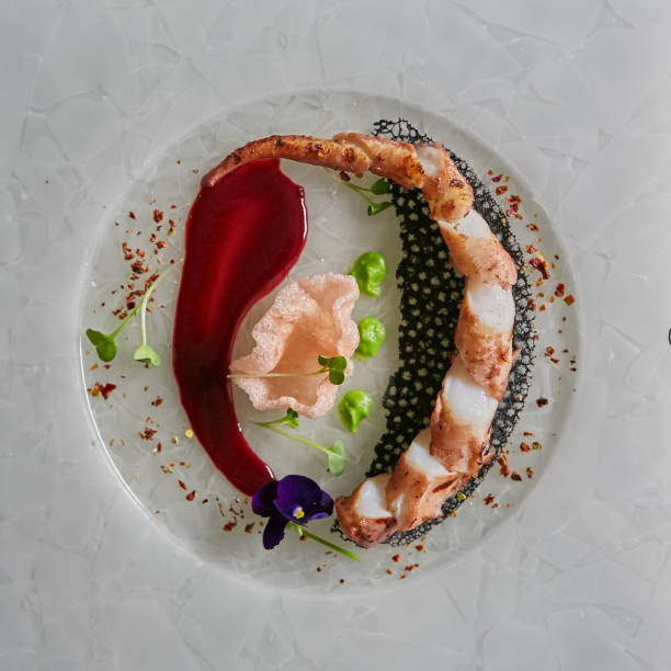 istock Close up squid tentacles on a white plate. Top view 921321910