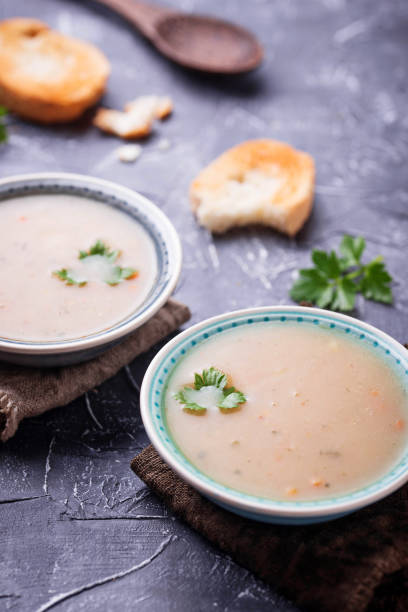 istock Healthy vegetarian peas soup on concrete background 921324740