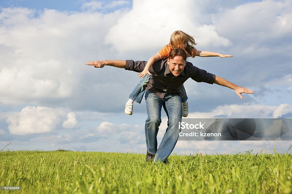 Father and kid playing together  Blue Stock Photo