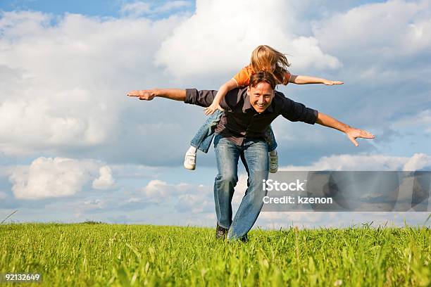 Father And Kid Playing Together Stock Photo - Download Image Now - Blue, Family, Sky