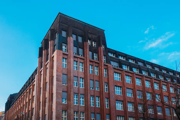 istock high contrasted and big office complex with brick facade 921327350