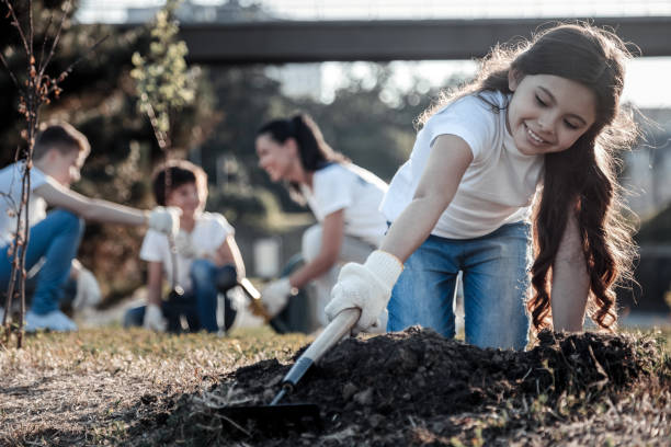 istock Nice pretty girl holding a rake 921330902